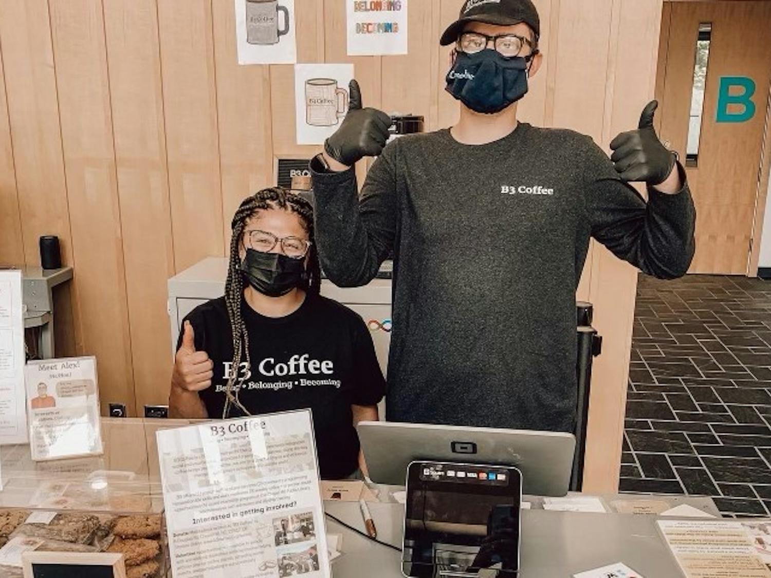 B3 Coffee team members Lauren Winnix and Alex Martel (left to right) work the kiosk on opening day at the Chapel Hill Public Library on Saturday, July 9, 2022. Photo courtesy of B3 co-founder Jacklyn Boheler.