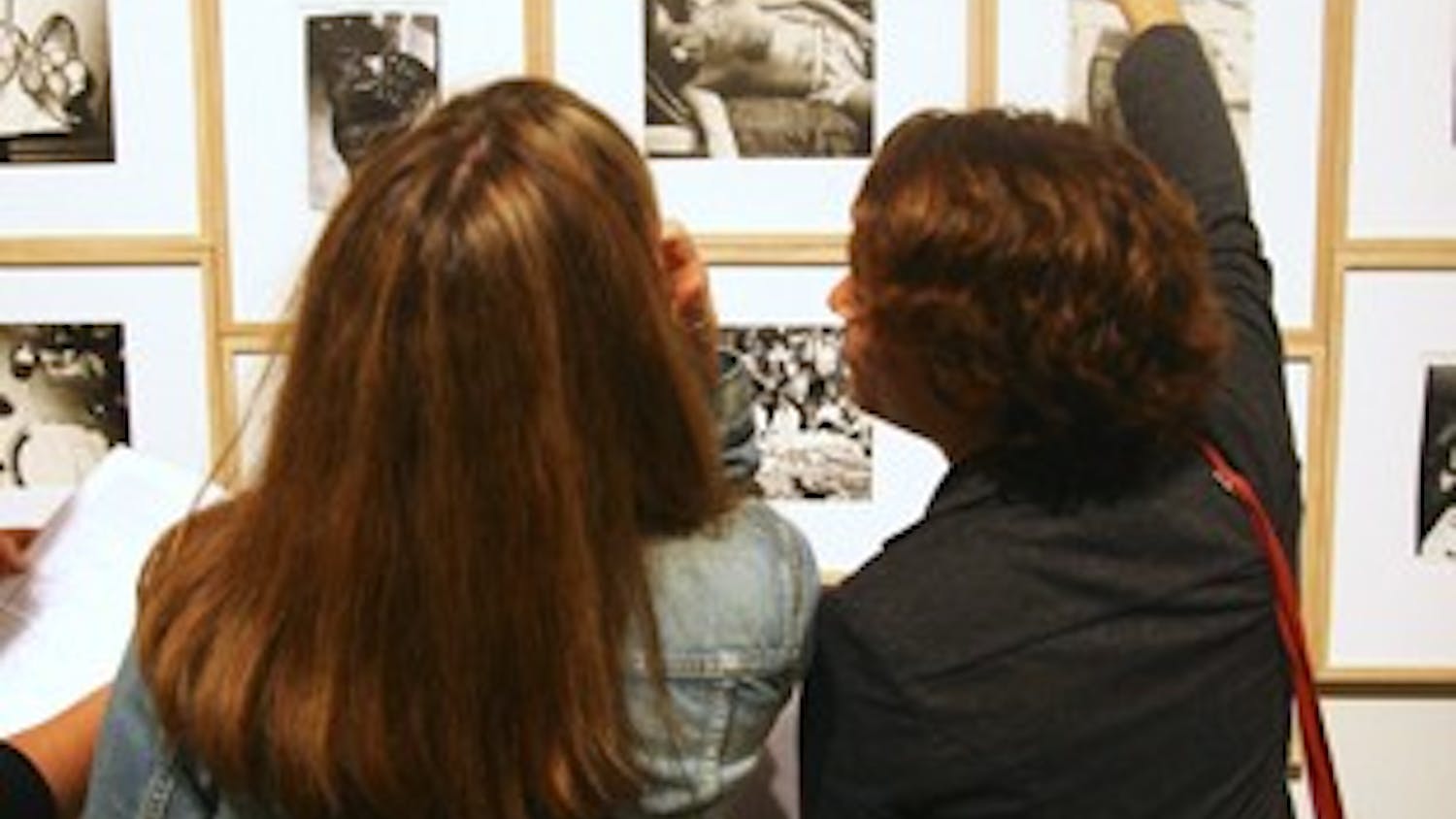 Lena Wegner (right) examines the Andy Warhol photo exhibit at the Ackland Art Museum with Lisa Voss (left) on Thursday night.