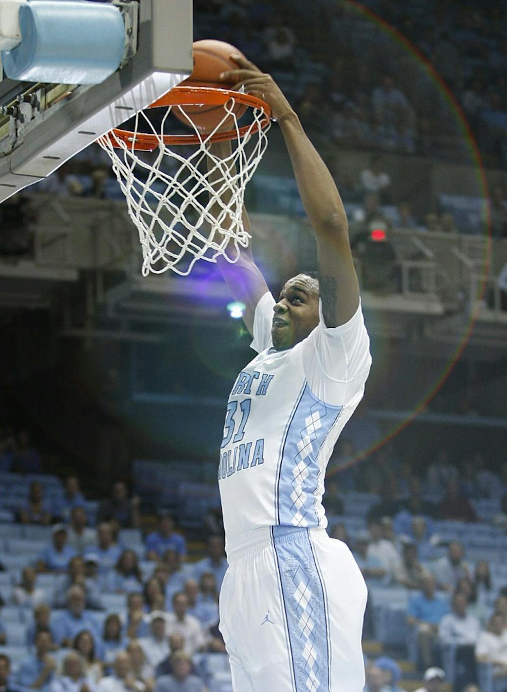 UNC forward John Henson dunks the ball during the first half of the game. Henson had 16 points in the Carolina win over Tennessee State.