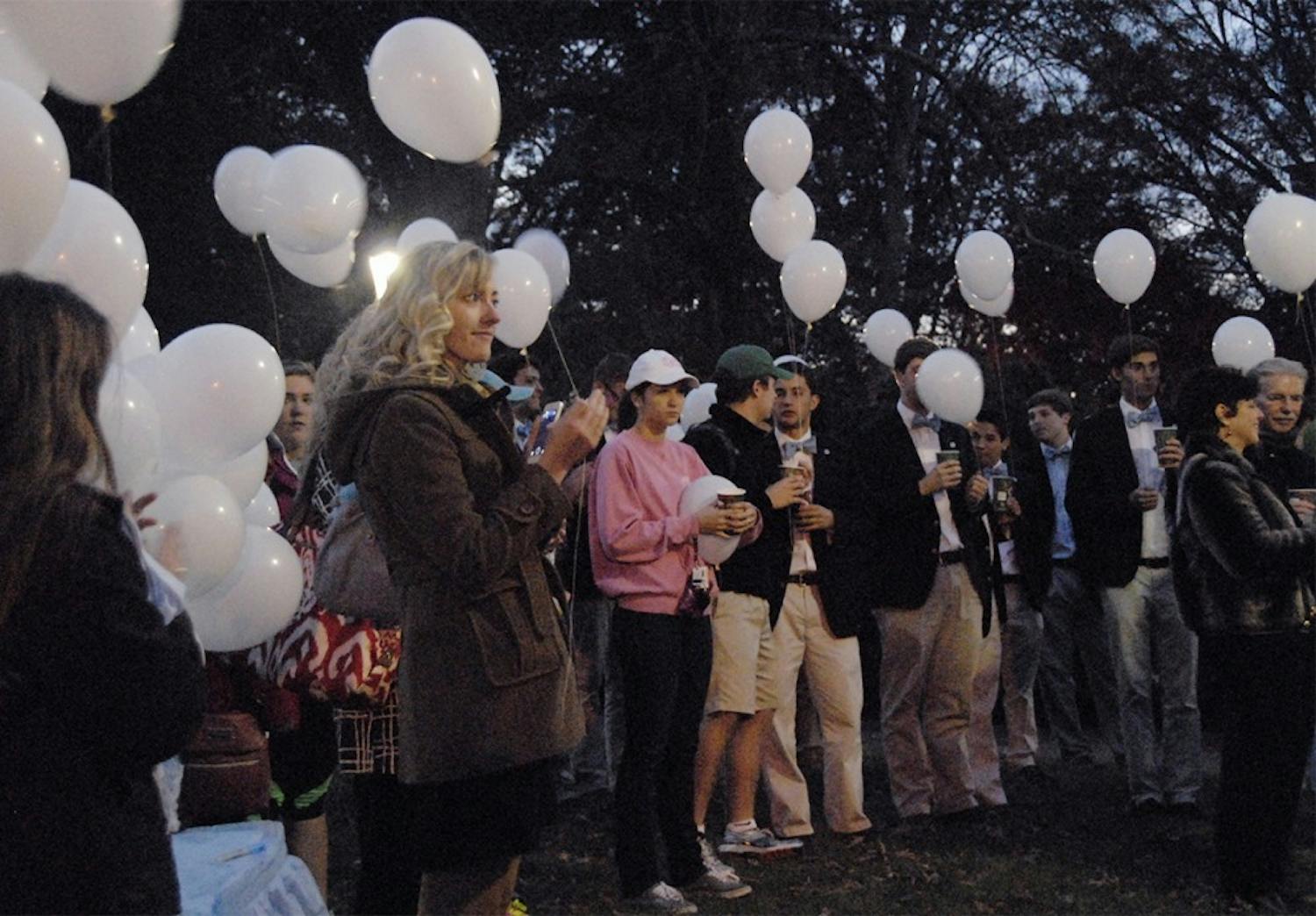 Students, faculty, and friends gather on the Morehead Planetarium lawn on Tuesday before releasing balloons in honor of the students who have passed as part of UNC's Tar Heels Forever. 