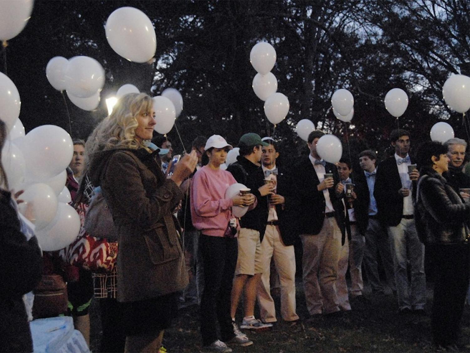 Students, faculty, and friends gather on the Morehead Planetarium lawn on Tuesday before releasing balloons in honor of the students who have passed as part of UNC's Tar Heels Forever. 