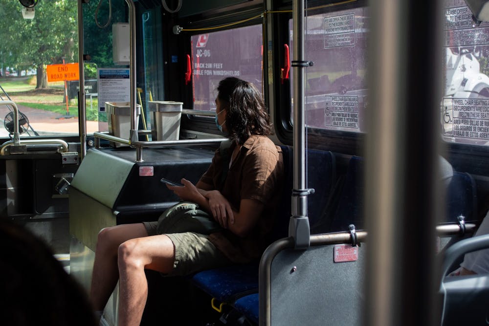 A student travels away from campus on a bus on the first day of classes, Aug. 18. 