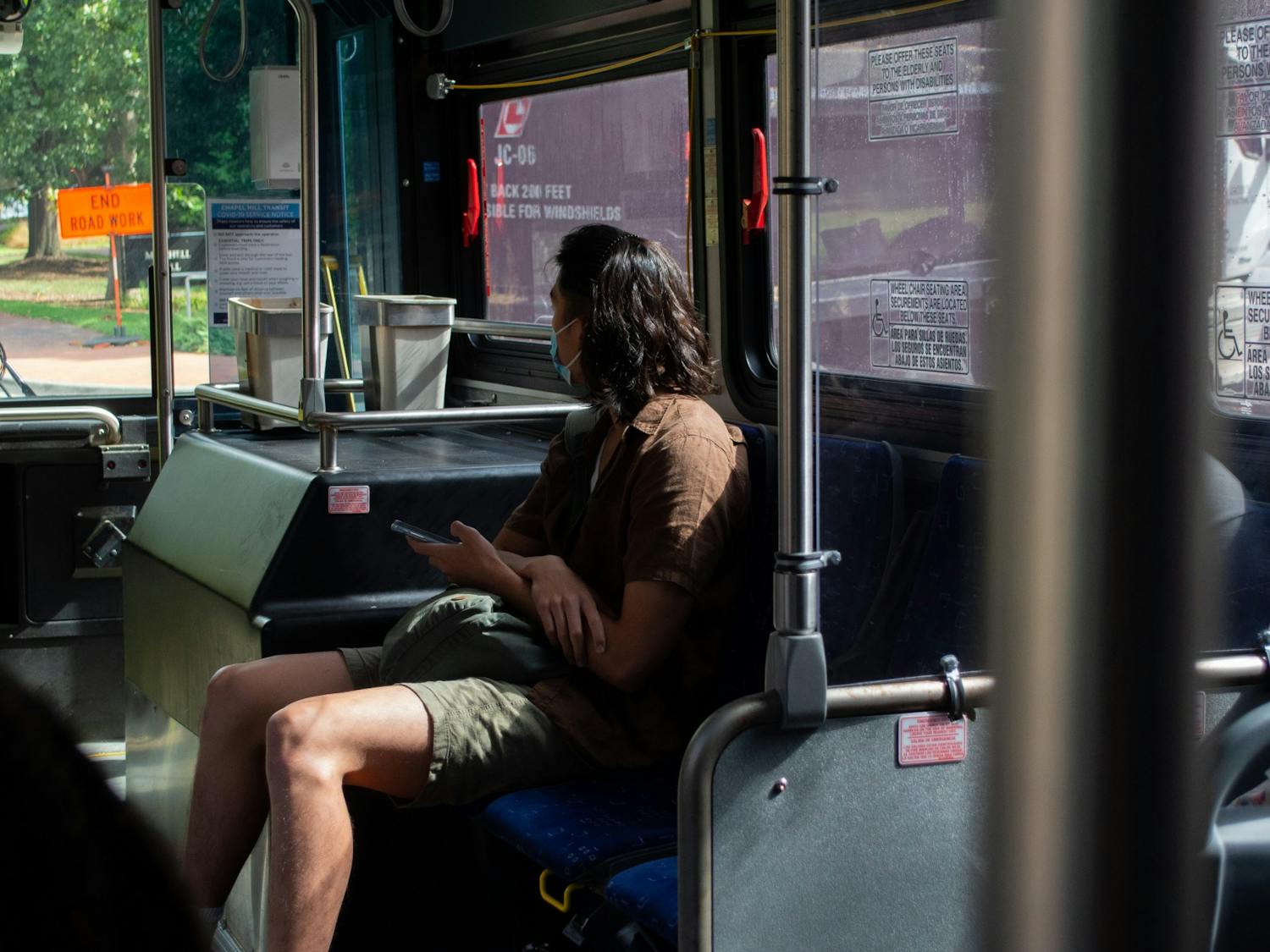 A student travels away from campus on a bus on the first day of classes, Aug. 18. 
