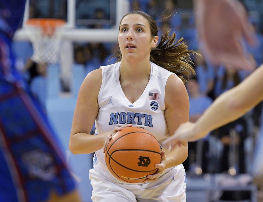 <p>Then-sophomore Liz Roberts, a walk-on guard, attempts a shot in Carolina's 91-56 win over Presbyterian at Carmichael Arena on December 5, 2017. Now a graduate assistant with the team, Roberts is hoping to use her experience at UNC as a springboard into a career in sports. Photo courtesy of Jeff Camarati/UNC Athletics</p>