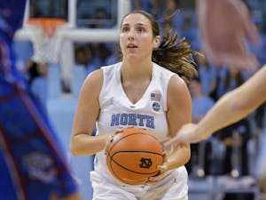 Then-sophomore Liz Roberts, a walk-on guard, attempts a shot in Carolina's 91-56 win over Presbyterian at Carmichael Arena on December 5, 2017. Now a graduate assistant with the team, Roberts is hoping to use her experience at UNC as a springboard into a career in sports. Photo courtesy of Jeff Camarati/UNC Athletics