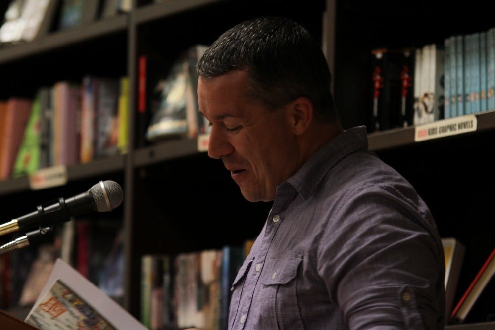 Ty Stumpf, the Chair of the Humanities Department at Central Carolina Community College, reads poems from his novel "Suburban Burn" at Flyleaf Books on Thursday evening.&nbsp;
