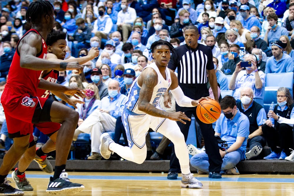 Sophomore guard Caleb Love (2) drives the ball to the basket at the game against NC State at the Smith Center in Chapel Hill on Jan. 29, 2022. UNC won 100-80.