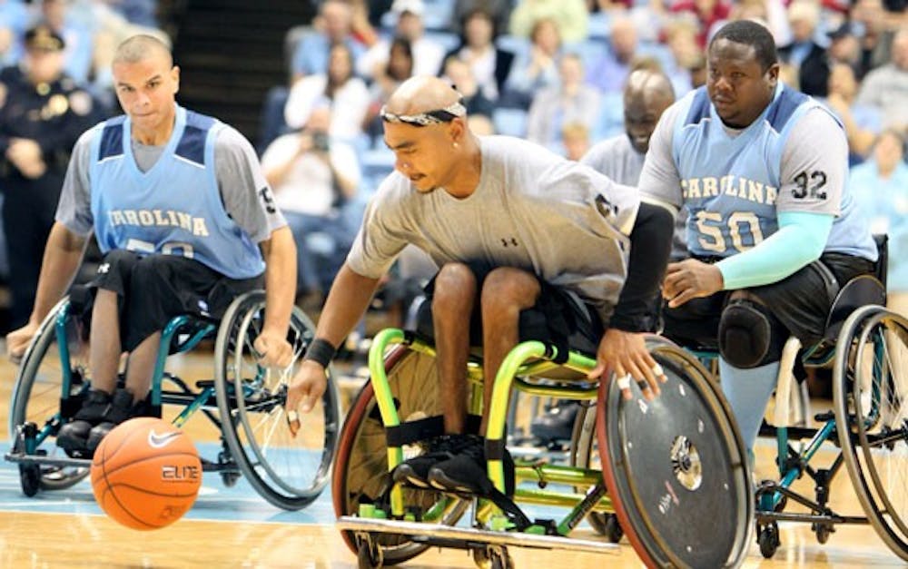 Participants of Bridge II Sports, a program for disabled athletes, play at halftime during UNC’s exhibition game. DTH/Phong Dinh