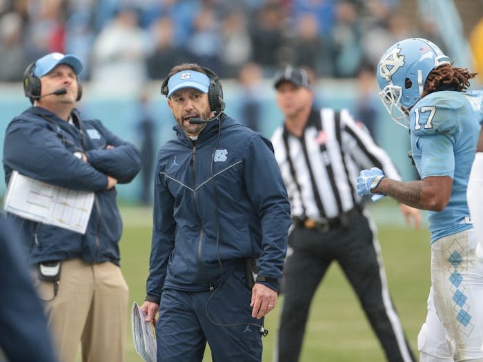 Larry Fedora coaches during the 34-28 loss to NC State on Saturday, Nov. 24, 2018 in Kenan Memorial Stadium.