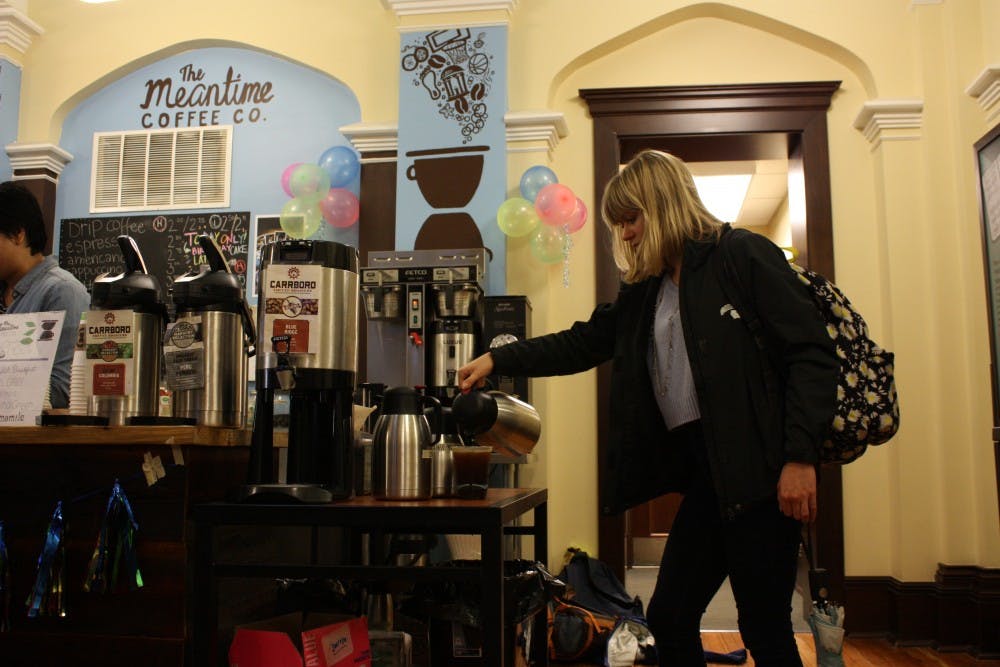 UNC senior Samantha Paisley pours coffee at The Meantime Coffee Co., which is located in the Campus Y. 