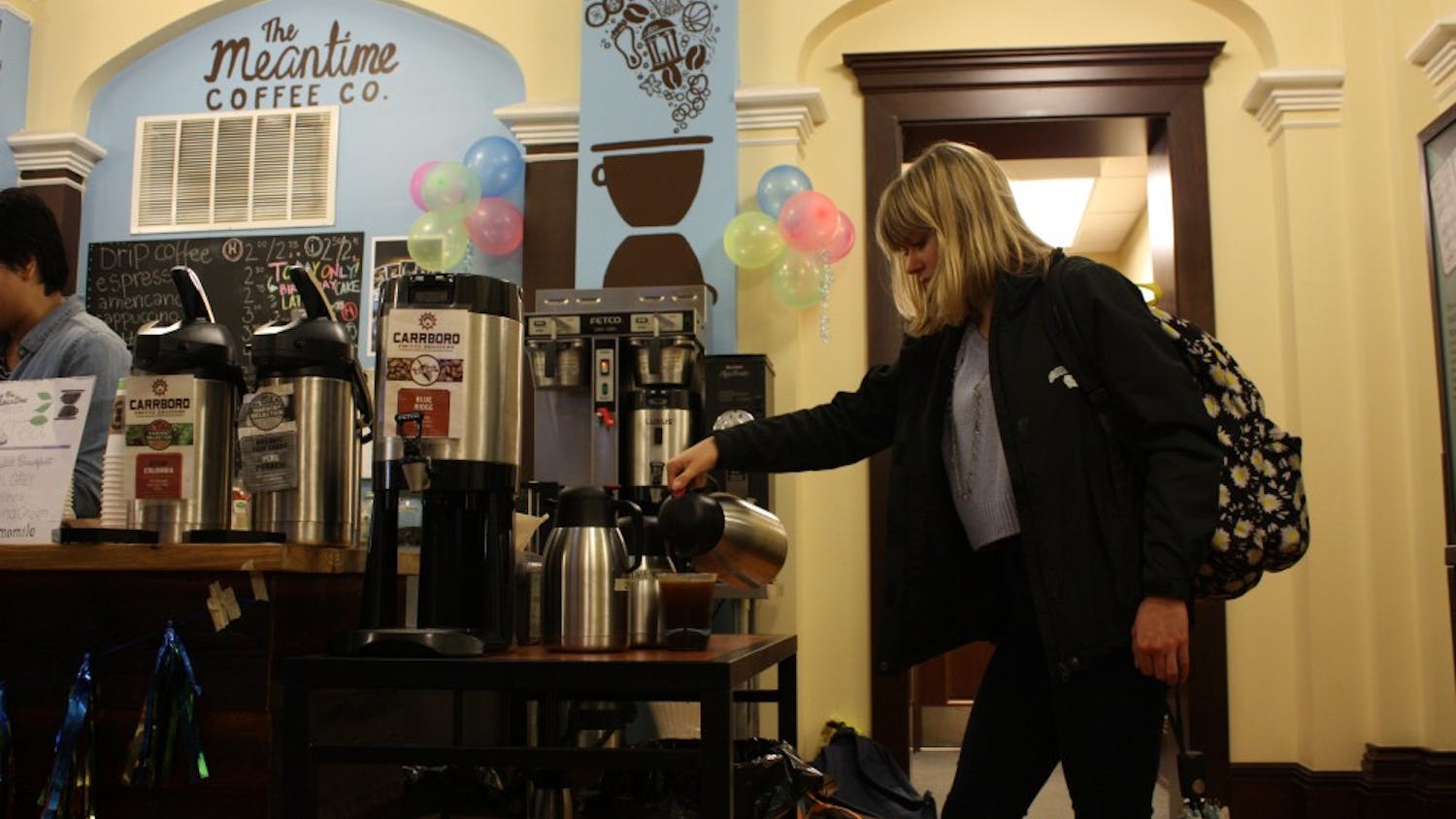 UNC senior Samantha Paisley pours coffee at The Meantime Coffee Co., which is located in the Campus Y. 