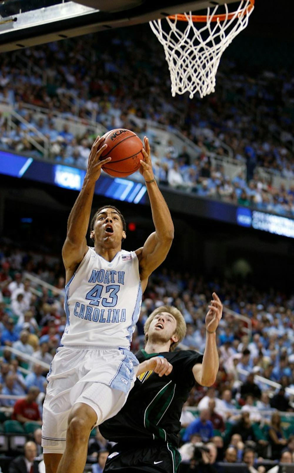 UNC forward James Michael McAdoo drives to the hoop. McAdoo had 17 points in the Tar Heels 77-58 win over Vermont in the second round of the NCAA tournament at the Greensboro Coliseum on Friday, March 16, 2012.