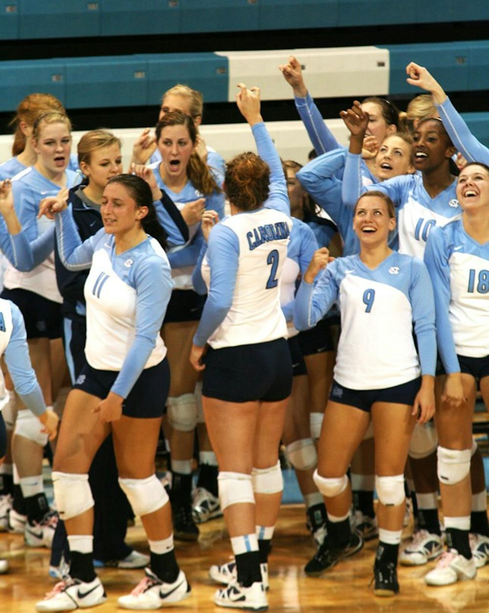 UNC volleyball players meet in their pregame routine before matches. The women use celebrations as way to increase energy during the games.