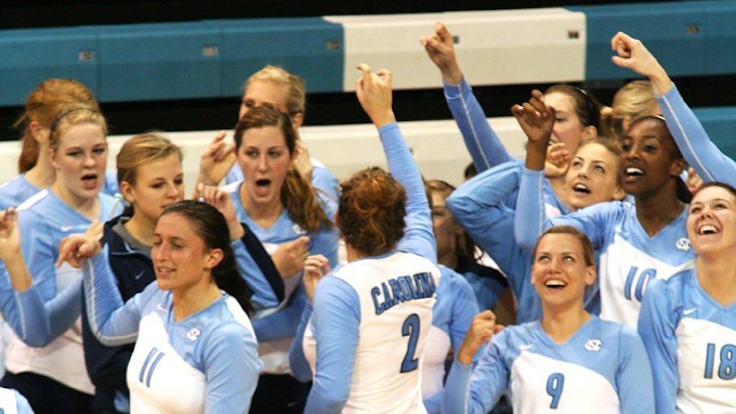 UNC volleyball players meet in their pregame routine before matches. The women use celebrations as way to increase energy during the games.