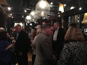 People arriving at City Kitchen for Pam Hemminger's election night party.