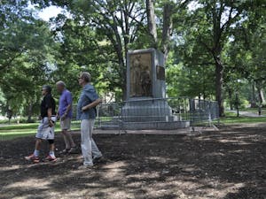 The pedestal where Silent Sam once stood surrounded by barricades Tuesday afternoon.