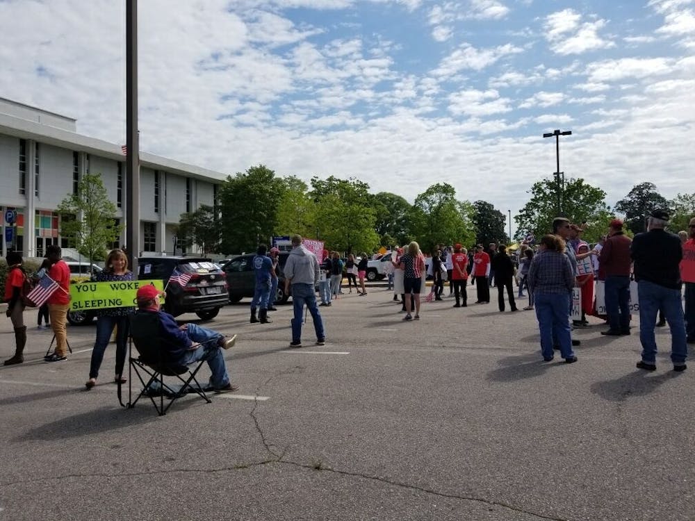 <p>Protesters gathered together in Raleigh on Tuesday, April 21, 2020 as part of the Reopen N.C. movement. Photo courtesy of Ashley Smith.&nbsp;</p>