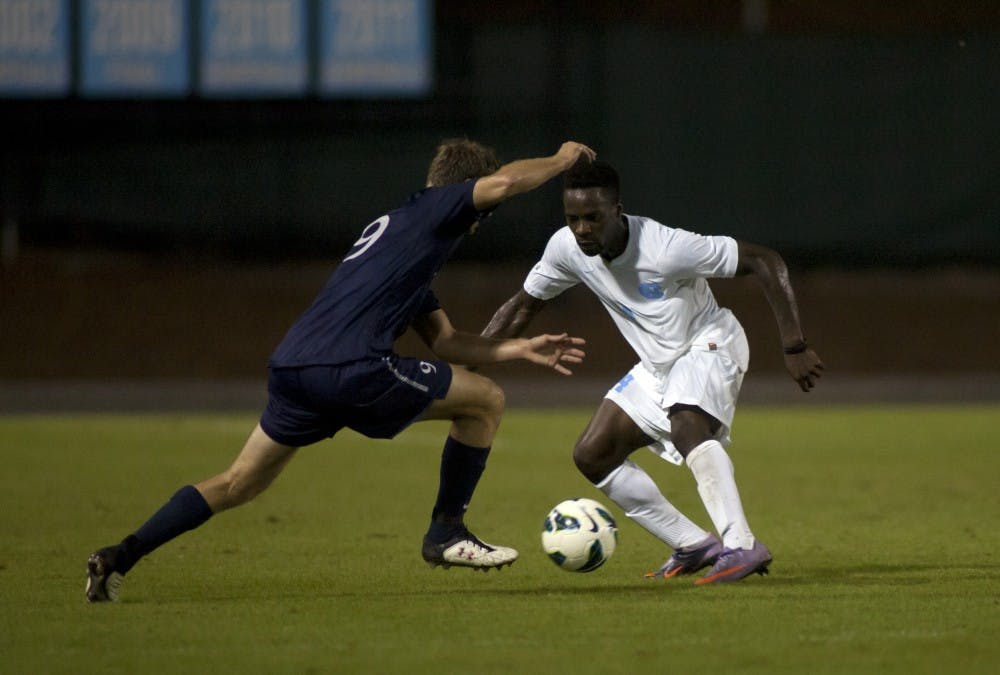 Tar Heel Boyd Okwuonu, who played the full 90 minutes, handles the ball during the first half. 