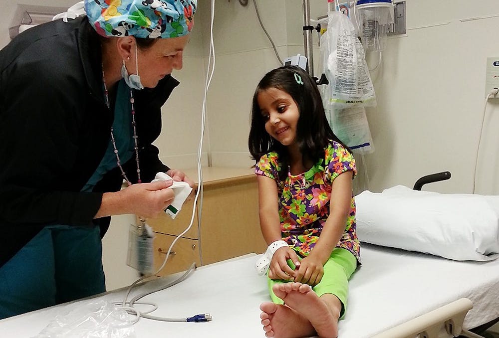 	<p>Chapel Hill resident Rita Bigham and her husband are helping fund surgery for 8-year-old Maryam. Courtesy of Ashley Lewis.</p>