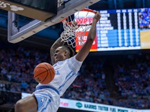 UNC senior forward Armando Bacot (5) dunks the ball during the men's basketball game against Duke at the Dean E. Smith Center on Saturday, March 4, 2023. UNC fell to Duke 62-57.