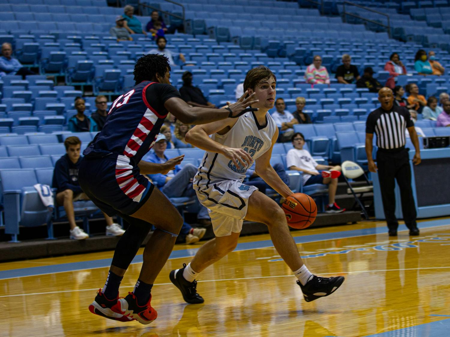 Sophomore forward William Tyndall (32) driving to the basket during the game against Athletes in Action in Dean E. Smith Center on Nov. 11, 2022.