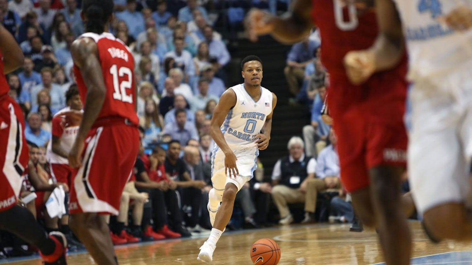 Guard Nate Britt (0) brings the ball to the top of the key.&nbsp;