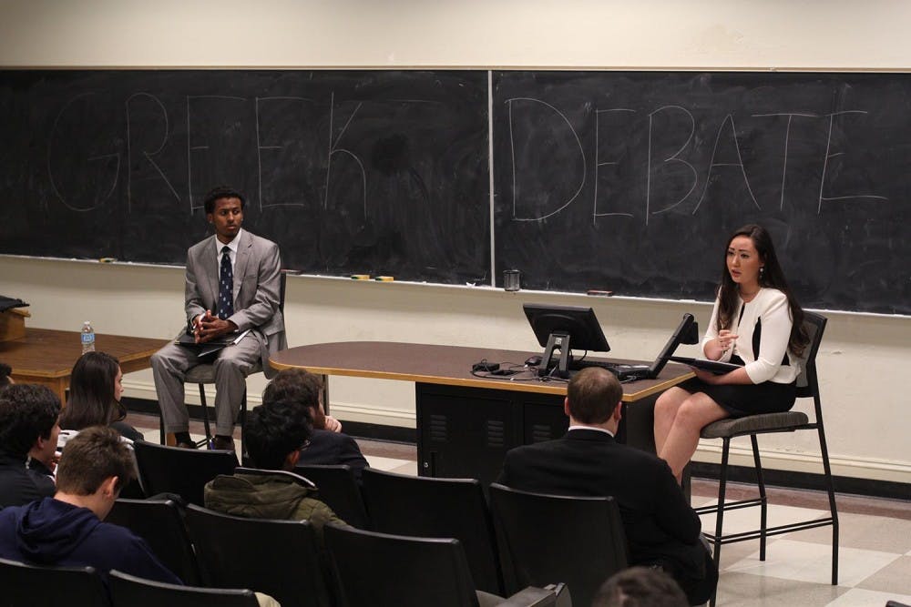 Student body president candidates Maurice Grier (left) and Elizabeth Adkins respond to questions asked by leaders of the Greek Organizations IFC, GAC, NPHC, and the PHC.