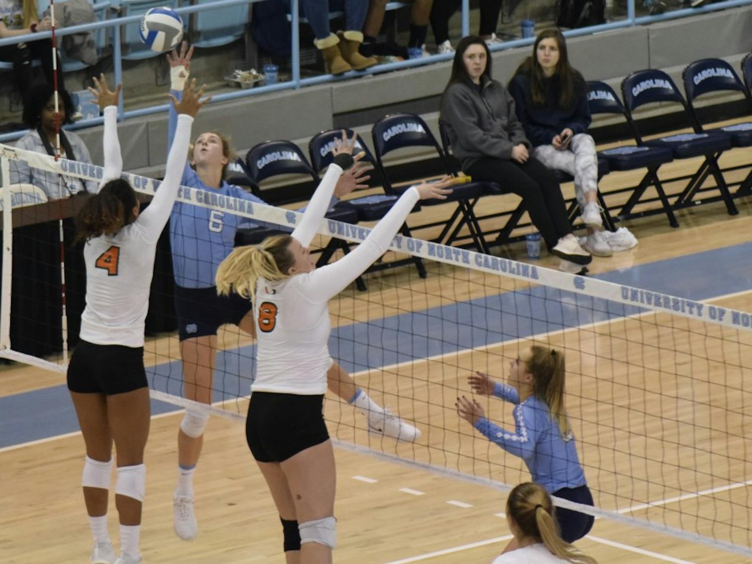 Junior Skylar Wine (6) tips the ball during the game against Miami on Sunday Oct. 11 at Carmichael Arena. UNC won 3-1.