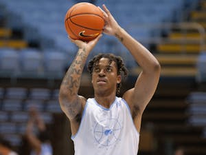 Junior forward/center Armando Bacot (5) throws the ball at the UNC men's basketball practice on Sept. 29 at the Dean Dome.