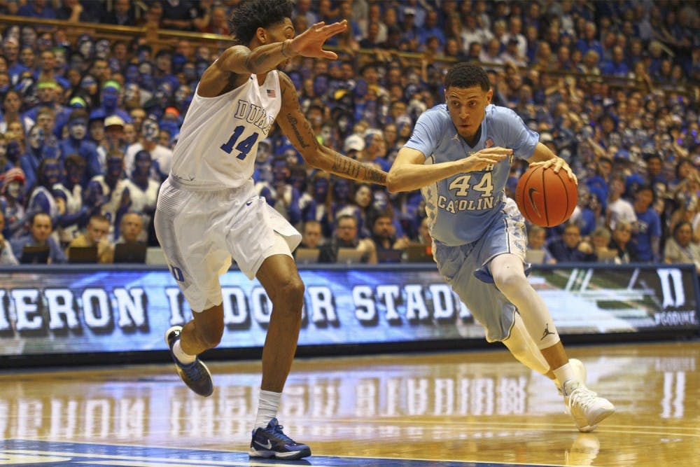 Justin Jackson (44) drives the ball down the court.