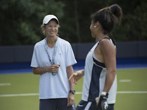 Karen Shelton, head coach of UNC's field hockey program, has led the team to six NCAA Championships since becoming head coach in 1981. She has been named National Coach of the Year five times and was inducted into the USA Field Hockey Hall of Fame in 1989.