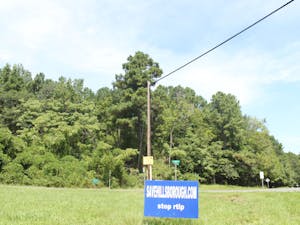 A sign at the proposed site for Research Triangle Logistics Park (RTLP) on Saturday, Sept. 5, 2020 advocates against the construction of the RTLP buildings on the 161-acre lot in Hillsborough, N.C.