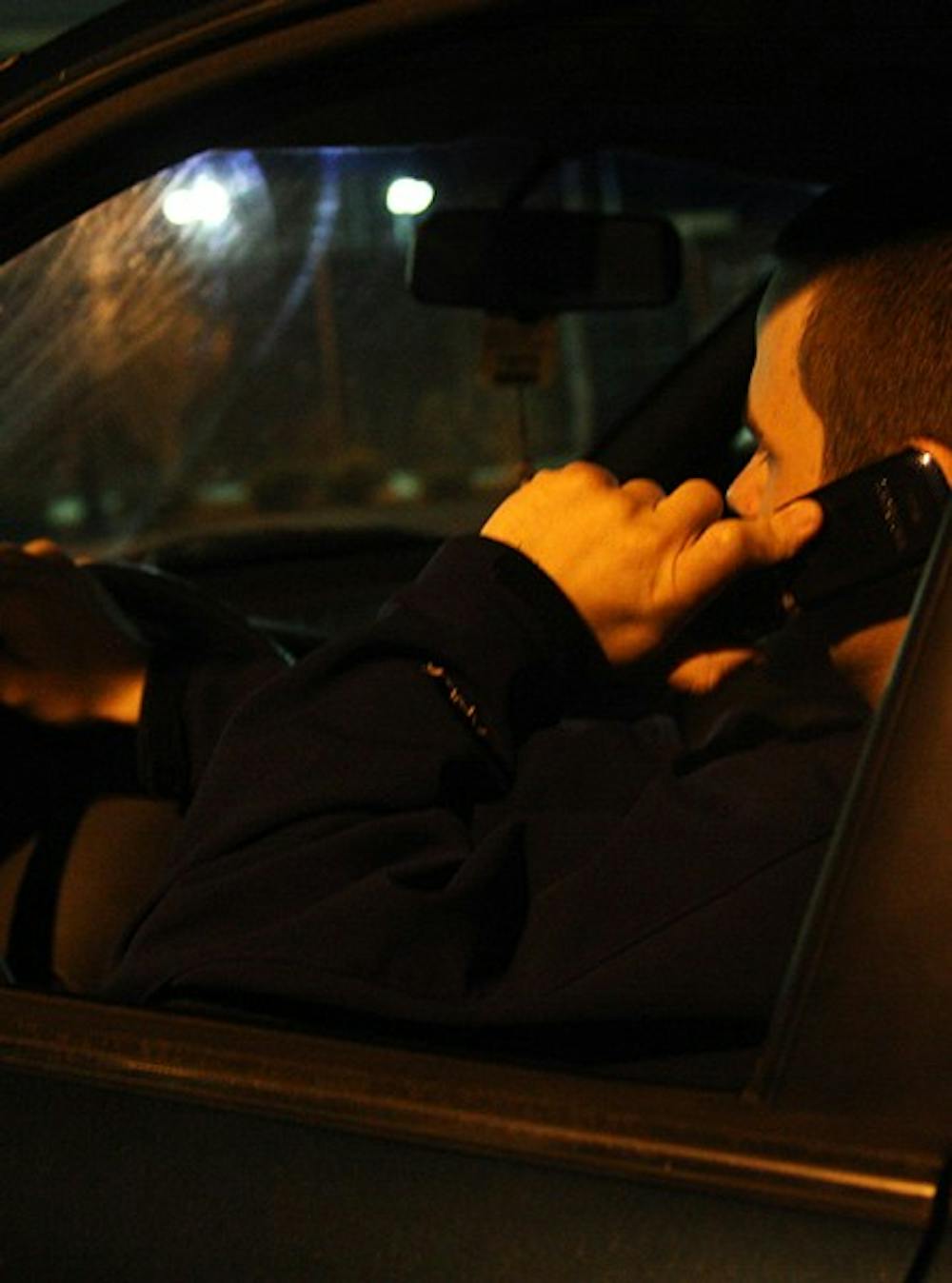 The Chapel Hill Town Council is considering a ban on cell phones while driving. DTHPhoto Illustration/Shar-narne Flowers