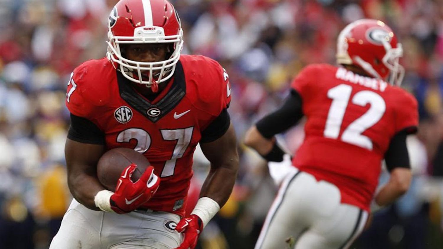 Georgia running back, Nick Chubb (27) turns to carry the ball upfield after receiving a handoff. Photo Courtesy of Joshua L. Jones of&nbsp;The Red and Black.&nbsp;