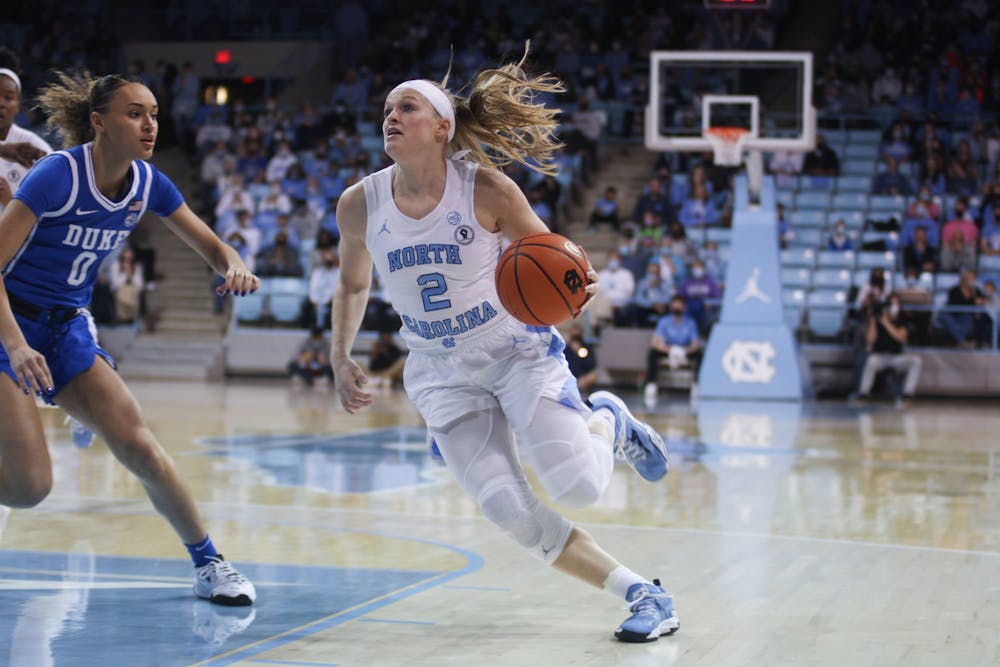 UNC graduate student guard Carlie Littlefield (2) drives the ball into the paint during a home women’s basketball game against Duke on Sunday, Feb. 27, 2022, at Carmichael Arena.