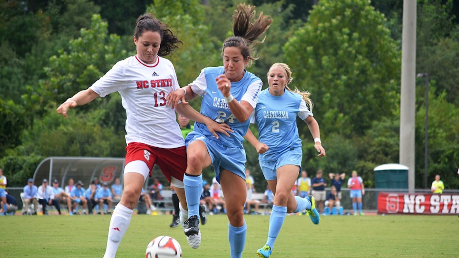 UNC's Paige Nielson (24) and NC State's Franziska Jaser (13) battle for the ball at Sunday's soccer game in Raleigh, North Carolina.  The Lady Tar Heel's won 2-1 against the Lady Wolfpack.