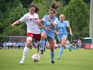 UNC's Paige Nielson (24) and NC State's Franziska Jaser (13) battle for the ball at Sunday's soccer game in Raleigh, North Carolina.  The Lady Tar Heel's won 2-1 against the Lady Wolfpack.