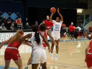 First year guard Deja Kelly attempts a three point shot during UNC women's basketball season opener against Radford on Wednesday, Nov. 25, 2020. UNC won 90-61.