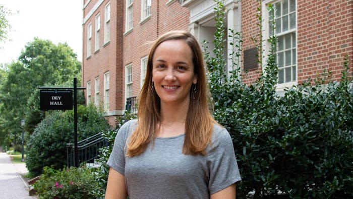 Anna Hamilton, a current PhD student in the department of American studies and the host of the Southern Oral History Workshop, poses outside of Dey Hall. Prior to her time at UNC, Hamilton received her undergraduate degree from the New College of Florida and a masters from the University of Mississippi.