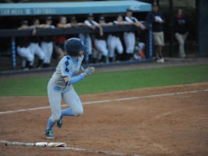 Senior Destiny DeBerry, number 22, runs for first base after hitting the ball at the UNC softball match against Liberty University on Wednesday, April 10, 2019 at the Anderson Softball Stadium. UNC won 3-2.