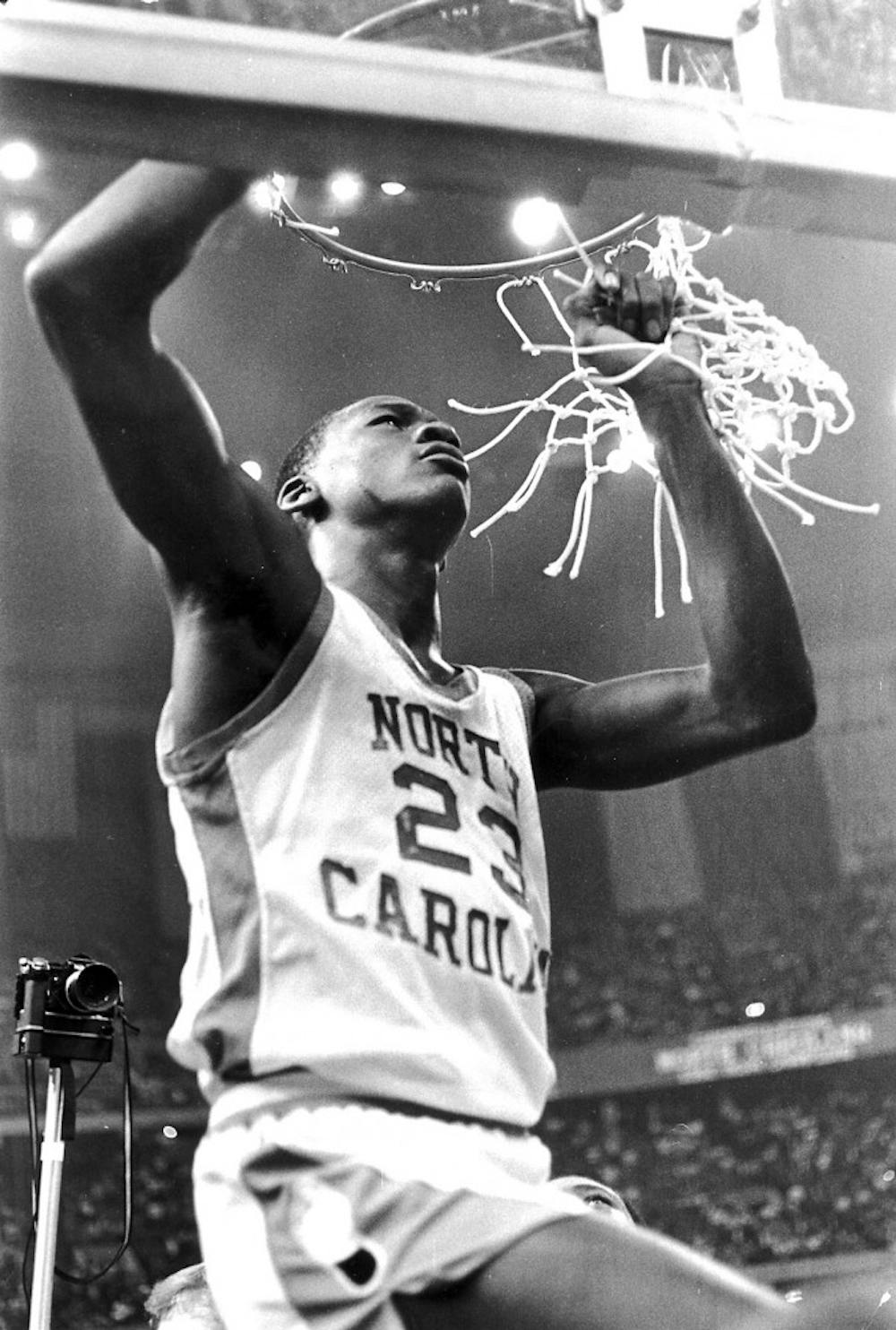 Michael Jordan helps cut down the nets. Courtesy of UNC Athletic Communications