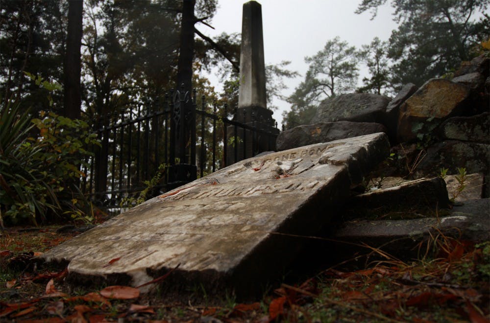 An old gravestone in the Old Chapel Hill Cemetery on South Road has fallen over.