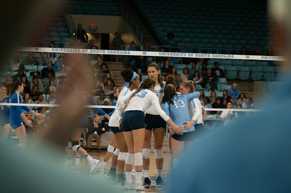 Junior Aristea Tontai convenes with her teammates after giving a point during UNC Volleyball's 3-0 win over Duke on thursday.