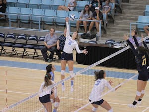 UNC outside hitter Skylar Wine (6) spikes against UNC-Greensboro Friday, Aug. 31 in Carmichael Arena.