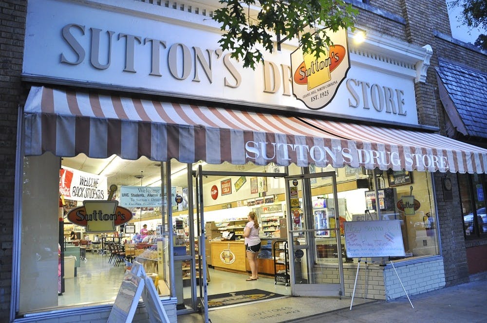 Sutton's Drug Store displays pictures of students, athletes and community members from their unique collection of "family photos."
