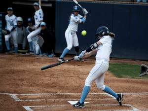 UNC catcher/first baseman Megan Dray (55) hits a triple with bases loaded during the 4-1 win over Georgia Tech on Friday, March 22, 2019 in Anderson Stadium in Chapel Hill, N.C. The Tar Heels improved their record to 6-1 in ACC play.