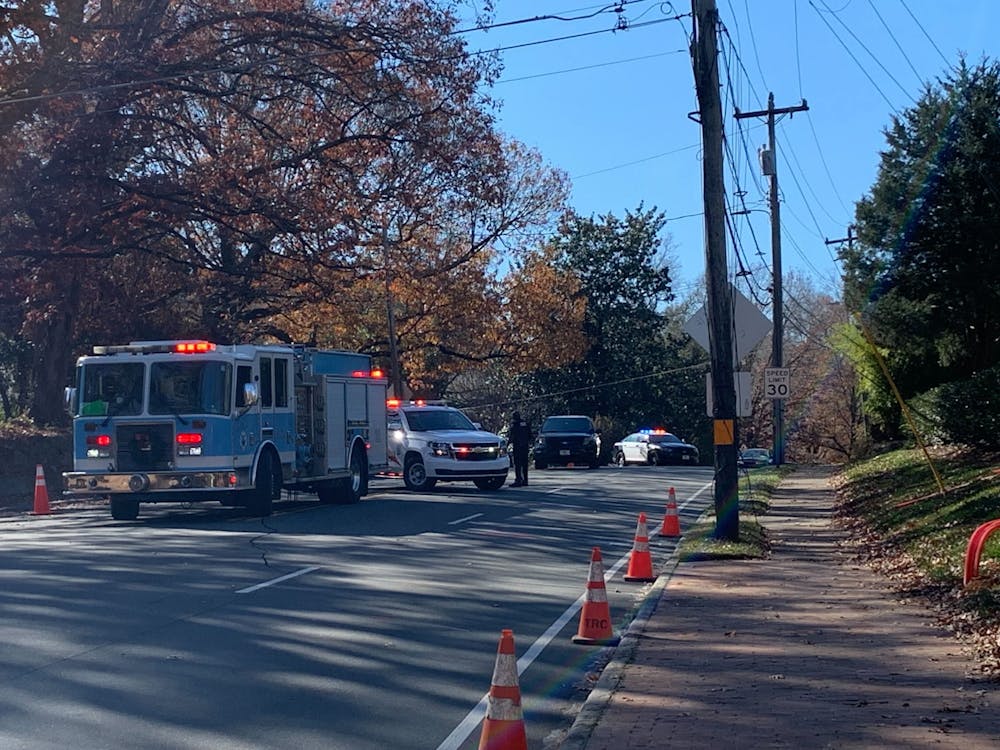 <p>The Chapel Hill Police Department and Fire Department block off Franklin Street between Boundary Street and Roosevelt Drive due to a gas leak on Friday, Dec. 3, 2021. Photo courtesy of Pete Villasmil.</p>