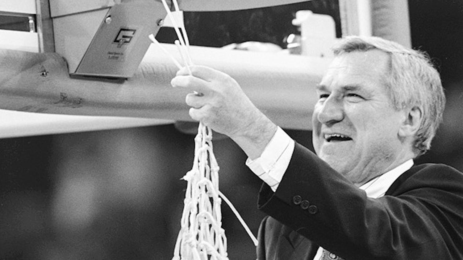 	Previous Head Coach Dean Smith cuts down the net at the UNC vs. Michigan NCAA championship game in New Orleans, L.A. in 1993. 

	Photo Courtesy of North Carolina Collection, UNC-CH