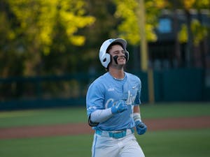 UNC junior infielder Colby Wilkerson (3) smiles from ear to ear after a home run in the April 11, 2023 baseball game against Queens University of Charlotte in Boshamer Stadium.