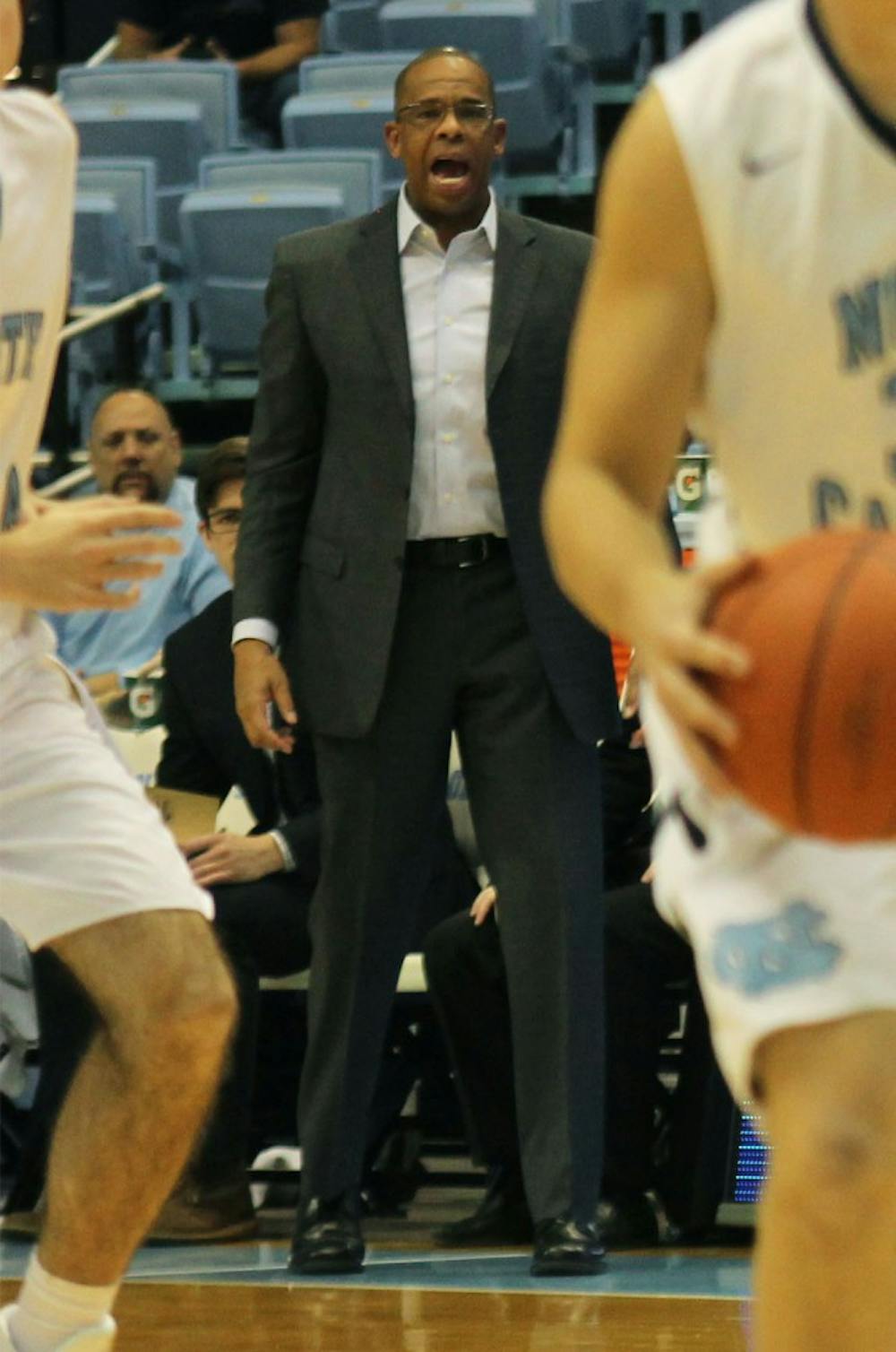 Head coach Hubert Davis talks to the junior varsity team from the sideline on Tuesday afternoon.&nbsp;